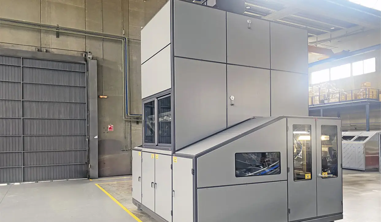 POSIMAT bottle unscrambler with an integrated 6,000-liter overhead storage silo for automated bottle feeding in household product packaging lines.